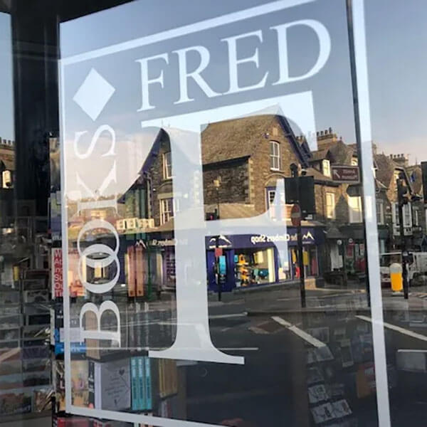 Fred's Logo etched into the shop door