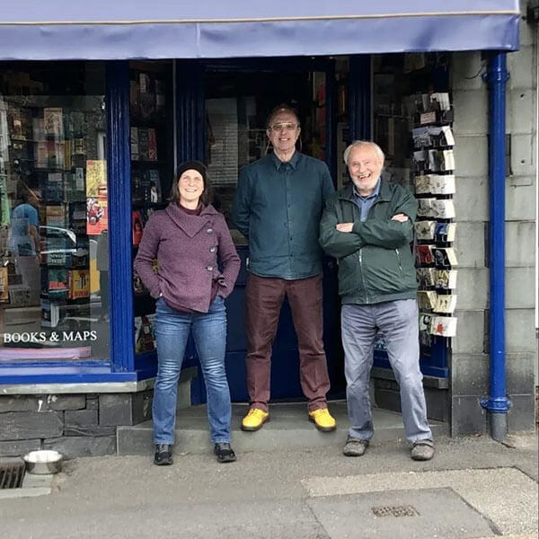 A group shot of the Fred's staff standing outside the door