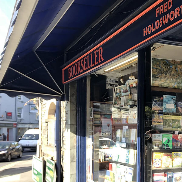 Close-up of the show window with the words Fred Holdsworth Bookseller at the top